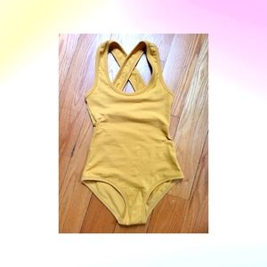 Like new ochre Arq halter crossback XXS bodysuit